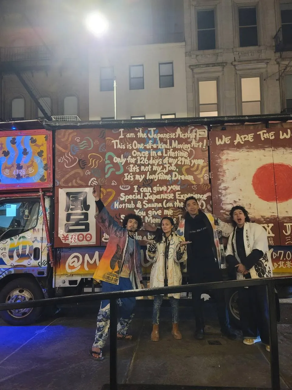 The Metaphormosa team in front of the painted sento truck at night